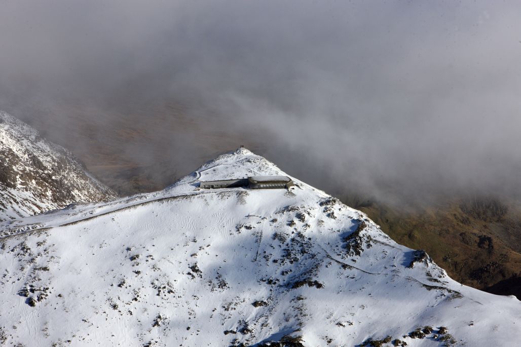 Snowdon in winter. © Crown Copyright RCAHMW.